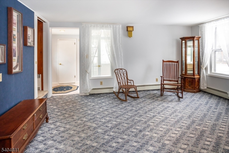 100 Troy Hills Road Whippany, NJ 07981 - Photo 10 of 37 a living room with furniture and a rug