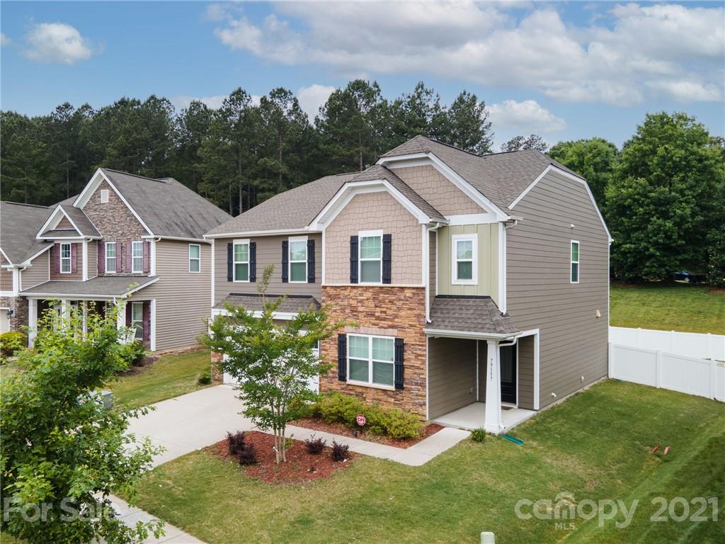 79157 Ridgehaven Road, Unit 154 Lancaster, SC 29720 - Photo 1 of 23 a front view of a house with a garden and plants