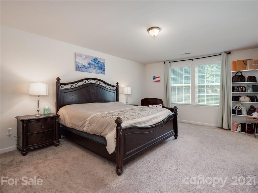 79157 Ridgehaven Road, Unit 154 Lancaster, SC 29720 - Photo 13 of 23 a bedroom with a bed and a window