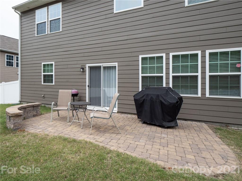 79157 Ridgehaven Road, Unit 154 Lancaster, SC 29720 - Photo 21 of 23 a view of a patio with couple of chairs in front of house