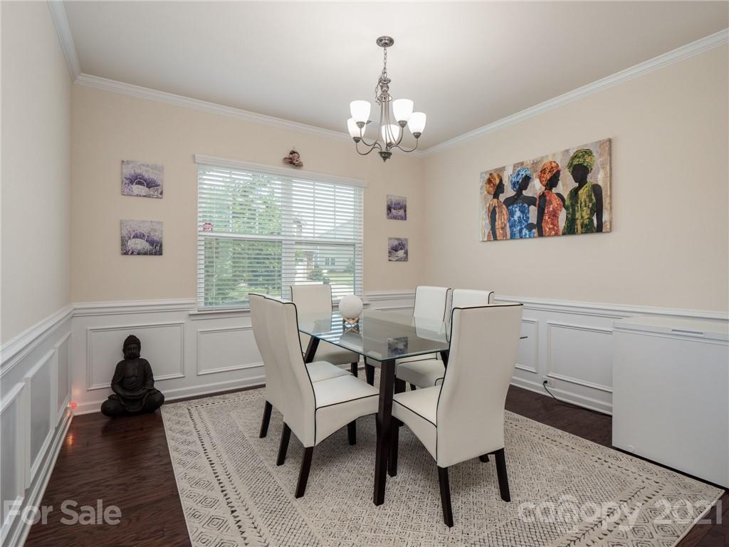 79157 Ridgehaven Road, Unit 154 Lancaster, SC 29720 - Photo 6 of 23 a living room with furniture and a chandelier