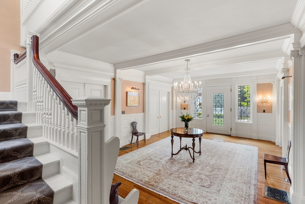 4 Cobb Avenue Manchester, MA 01944 - Photo 16 of 41 a living room with furniture and a chandelier