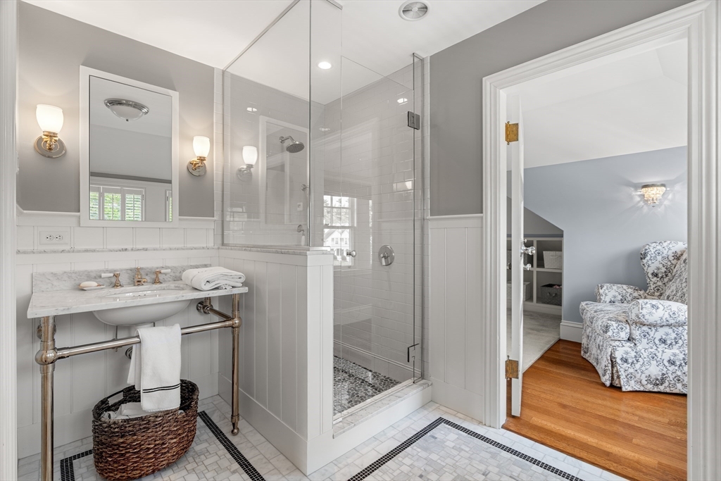 4 Cobb Avenue Manchester, MA 01944 - Photo 34 of 41 a bathroom with a sink and a mirror