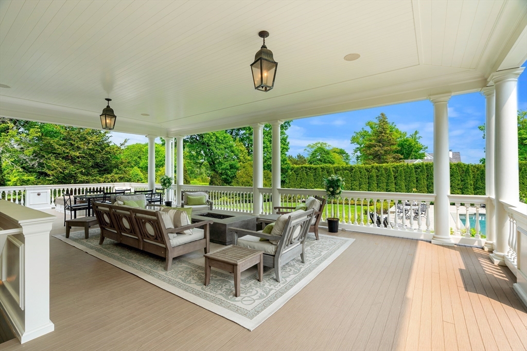 4 Cobb Avenue Manchester, MA 01944 - Photo 5 of 41 a living room with large windows and a table