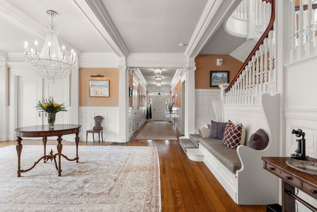 4 Cobb Avenue Manchester, MA 01944 - Photo 7 of 41 a living room with couches and a chandelier