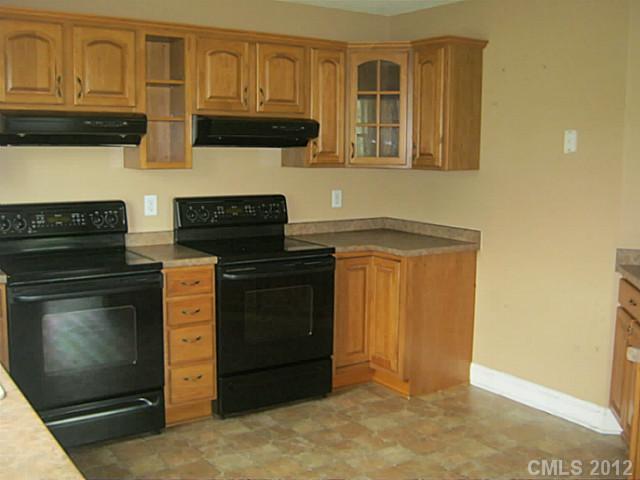 147 Laren Road Shelby, NC 28152 - Photo 13 of 16 a kitchen with granite countertop cabinets and steel stainless steel appliances