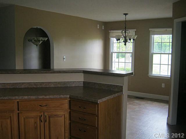 147 Laren Road Shelby, NC 28152 - Photo 14 of 16 a kitchen with a sink and a mirror