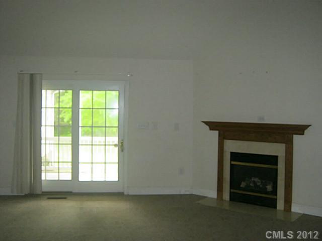 147 Laren Road Shelby, NC 28152 - Photo 4 of 16 an empty room with a fireplace