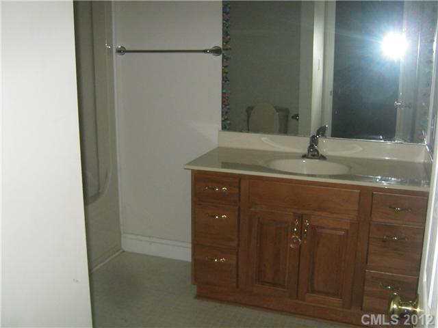147 Laren Road Shelby, NC 28152 - Photo 7 of 16 a bathroom with a granite countertop sink and a mirror