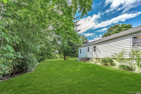 a backyard of a house with lots of green space