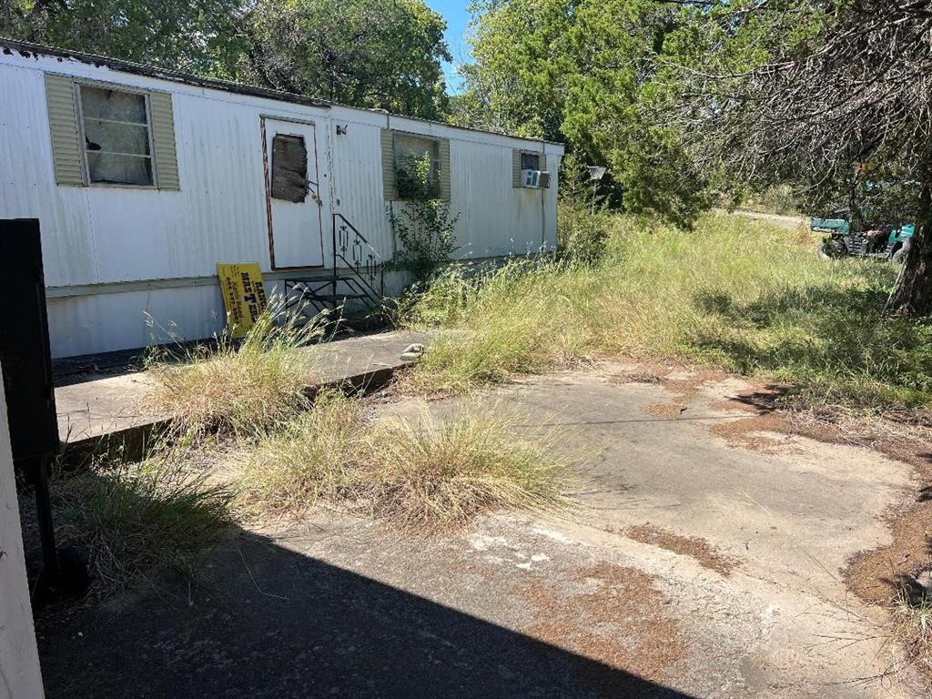 1701 Tbd County Road Clifton, TX 76634 - Photo 3 of 14 a backyard of a house with lots of green space