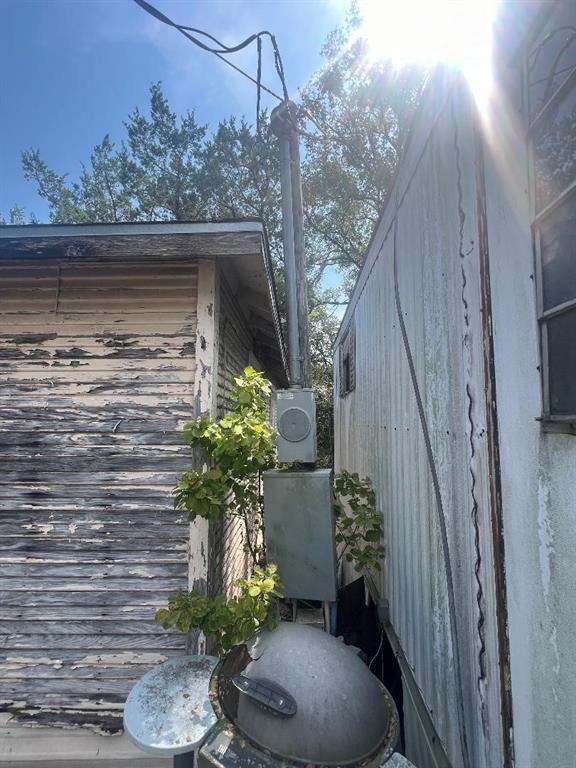 1701 Tbd County Road Clifton, TX 76634 - Photo 6 of 14 a vase with flowers sitting on a table in front of a house
