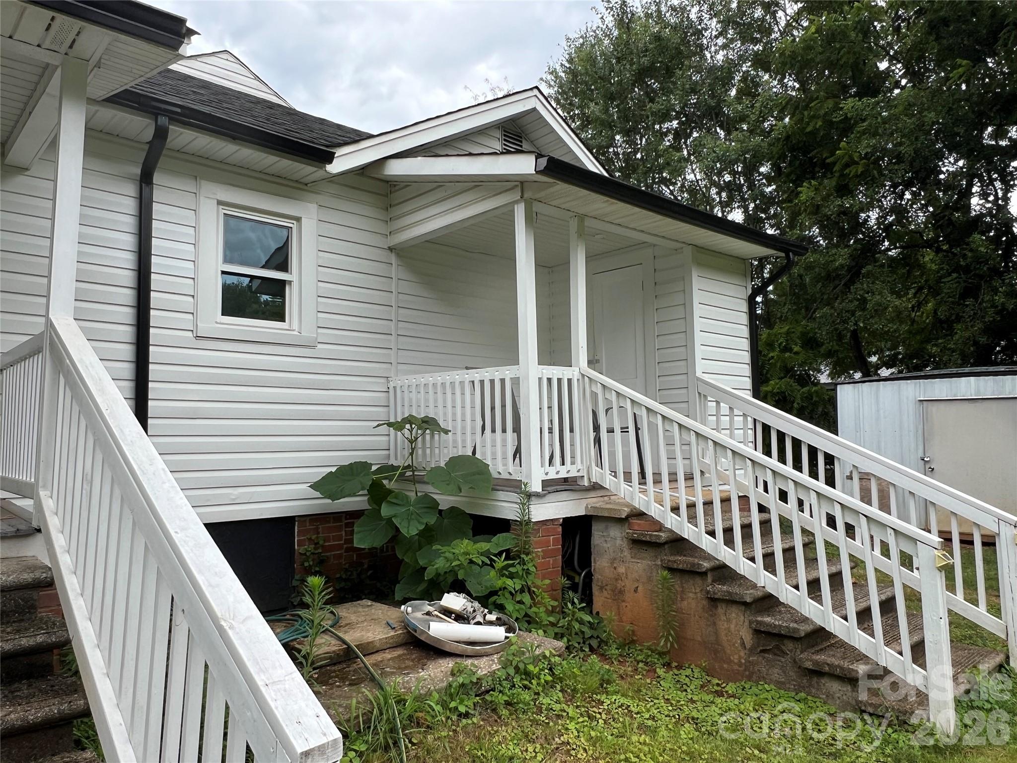 473 Boss Moore Road Ellenboro, NC 28040 - Photo 29 of 29 a balcony with wooden floor potted plants and wooden floor