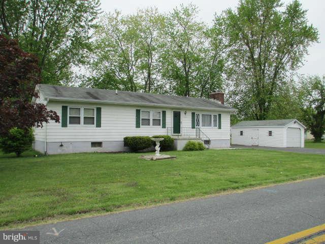 7301 Gunpowder Road Baltimore, MD 21220 - Photo 1 of 29 a front view of a house with a yard and porch