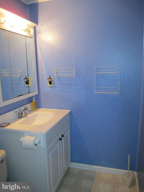 7301 Gunpowder Road Baltimore, MD 21220 - Photo 13 of 29 a bathroom with a sink and a mirror