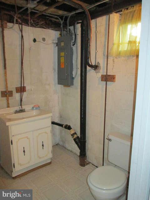 7301 Gunpowder Road Baltimore, MD 21220 - Photo 19 of 29 a bathroom with a granite countertop sink toilet and shower