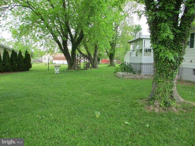 7301 Gunpowder Road Baltimore, MD 21220 - Photo 21 of 29 a view of a backyard with large trees