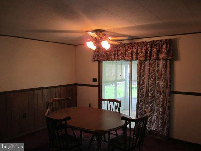 7301 Gunpowder Road Baltimore, MD 21220 - Photo 9 of 29 a view of a dining room with furniture and window
