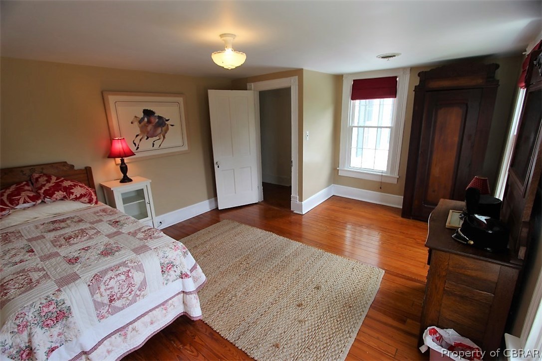 277 Mill Lane Road Cardinal, VA 23025 - Photo 36 of 47 a bedroom with a bed and a flat screen tv