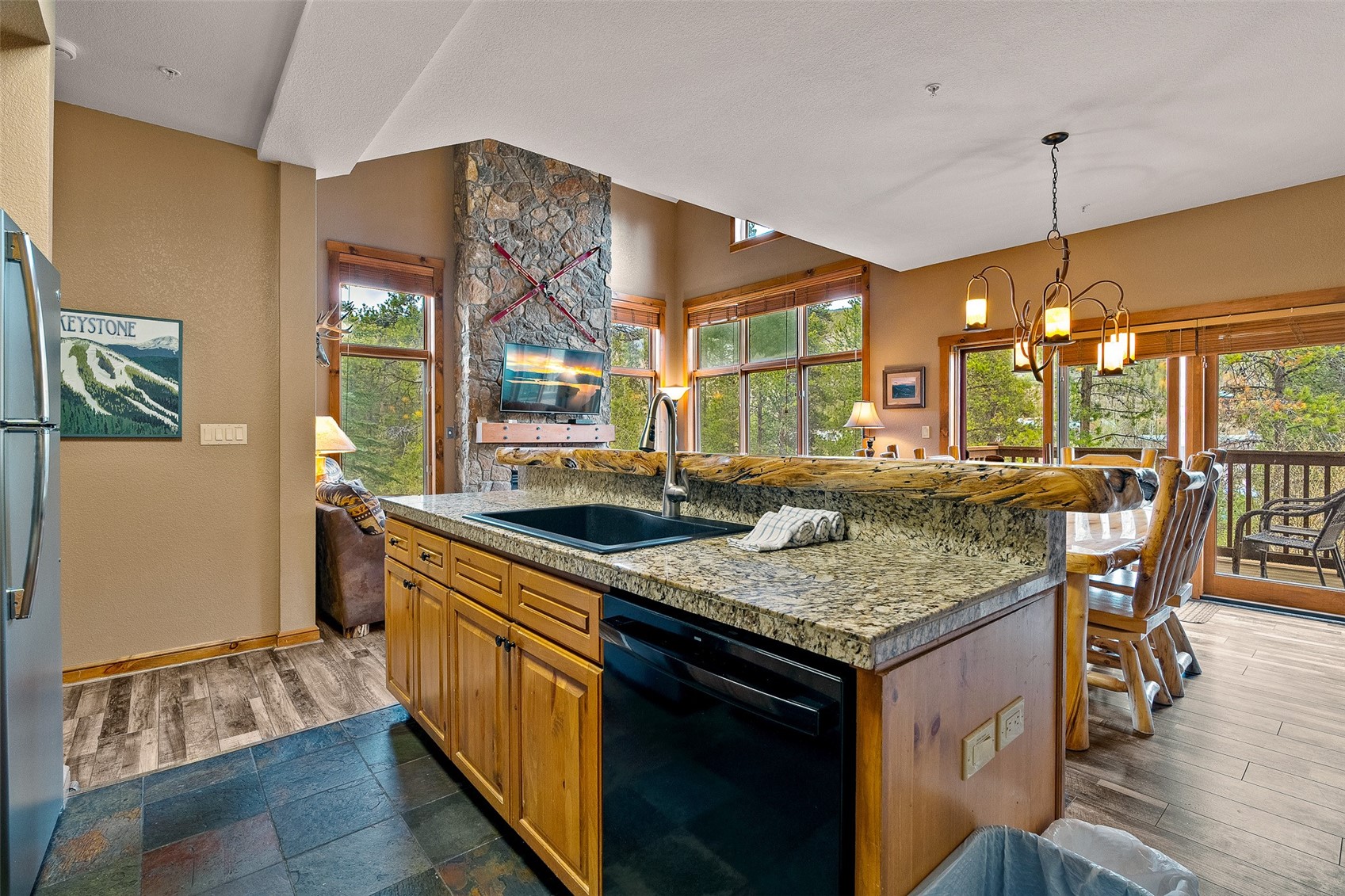 57 Lake Ridge Circle, Unit 1848 Keystone, CO 80435 - Photo 4 of 49 a kitchen with a stove and a wooden floor