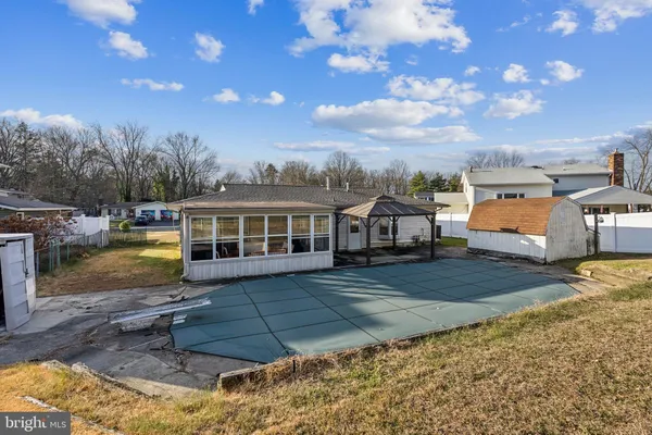 a view of a big house with a big yard