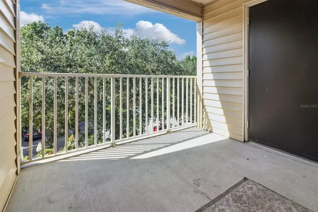 a view of a balcony with an outdoor space