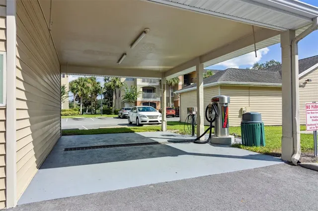 a view of a porch with a table and chairs
