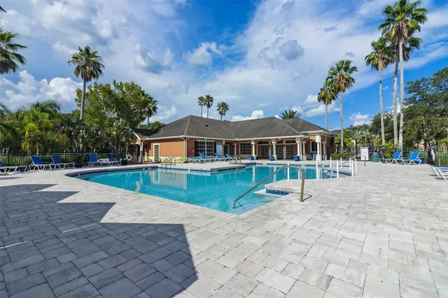 a front view of house with yard and trees around