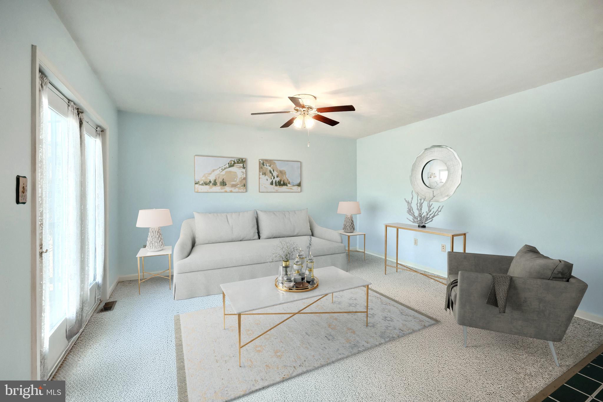 105 Wheaton Drive Littlestown, PA 17340 - Photo 12 of 39 a living room with furniture and a large window