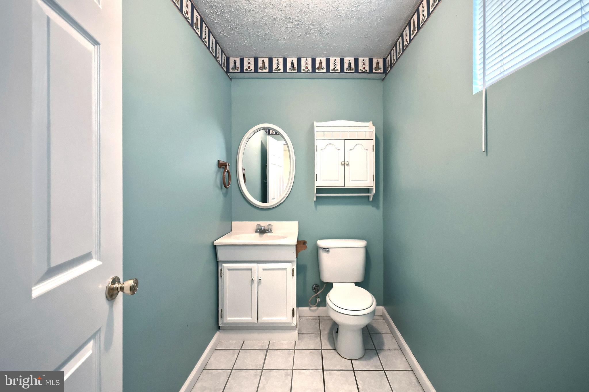 105 Wheaton Drive Littlestown, PA 17340 - Photo 20 of 39 a bathroom with a toilet and a mirror