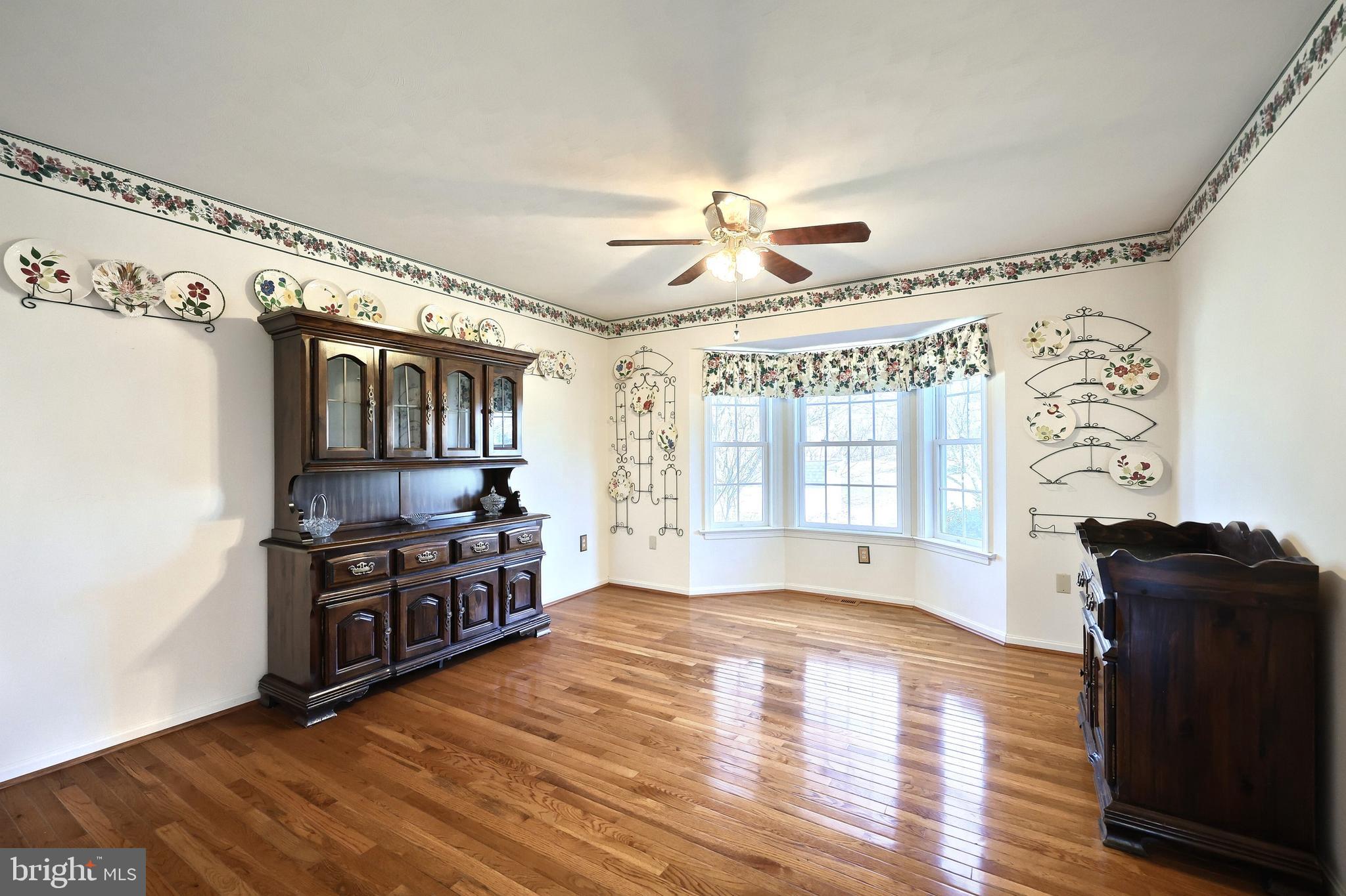 105 Wheaton Drive Littlestown, PA 17340 - Photo 5 of 39 a view of a kitchen with a stove cabinets and wooden floor
