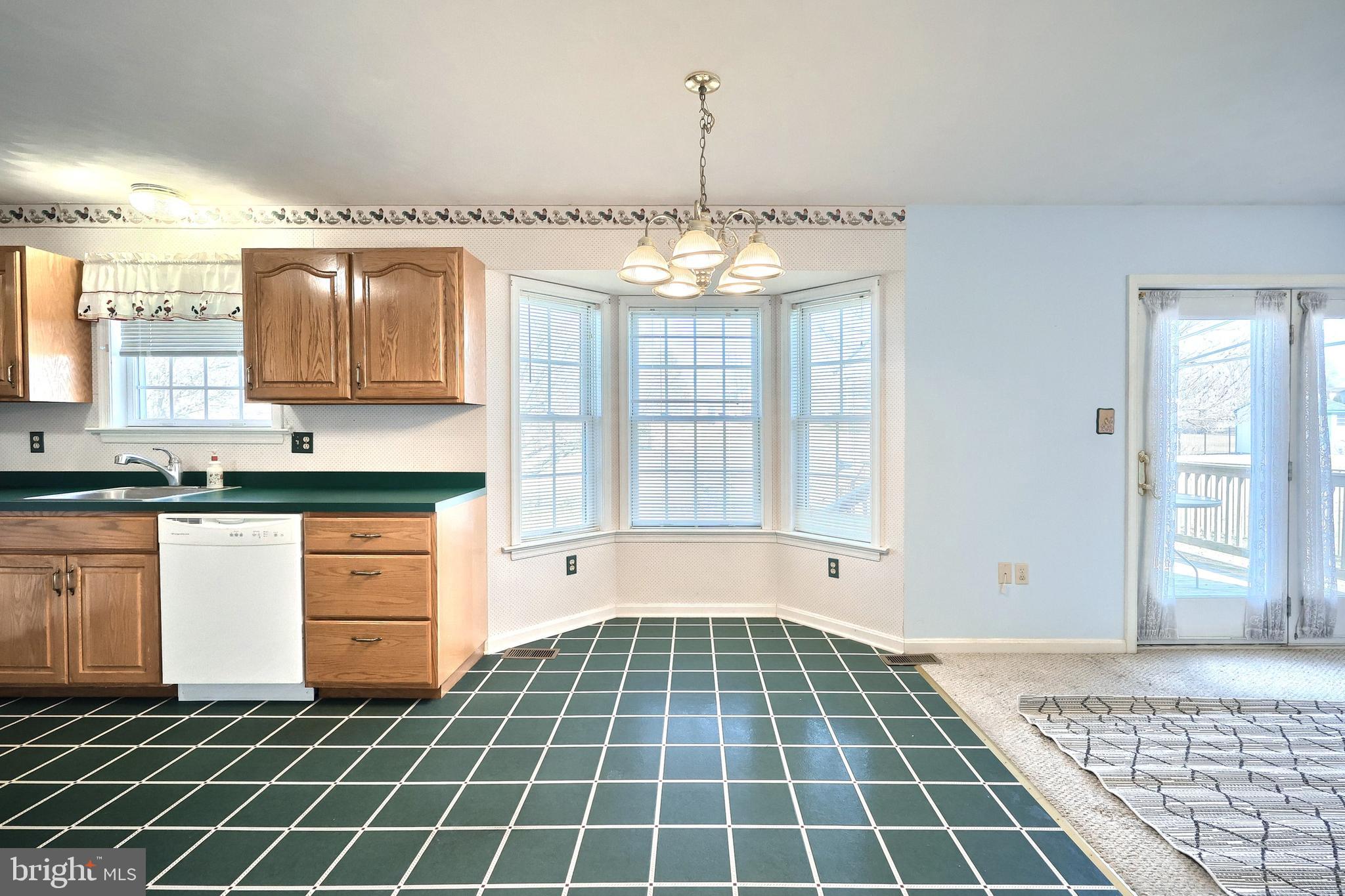 105 Wheaton Drive Littlestown, PA 17340 - Photo 9 of 39 a view of kitchen with granite countertop cabinets and window