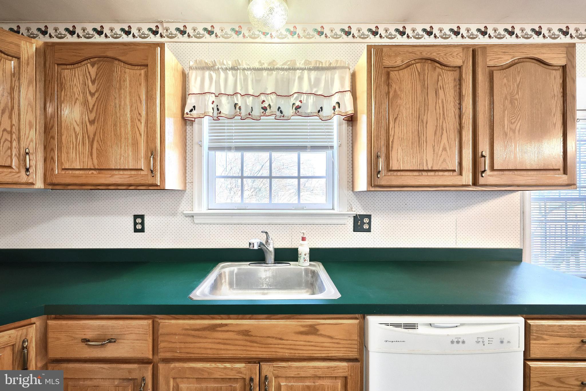 105 Wheaton Drive Littlestown, PA 17340 - Photo 10 of 39 a kitchen with a sink cabinets and window