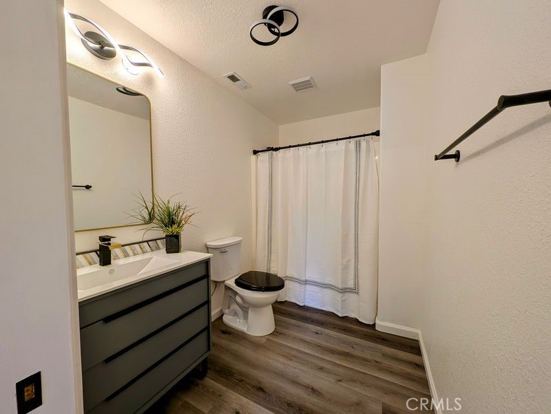 5377 Lancaster Road Lakeport, CA 95453 - Photo 18 of 20 a bathroom with a sink toilet a mirror and shower