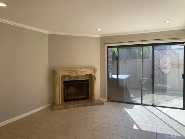 a view of an empty room with a fireplace