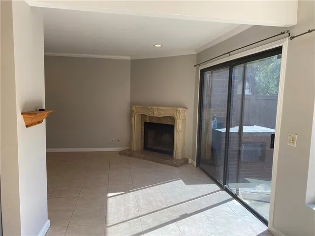 a view of an empty room with a fireplace