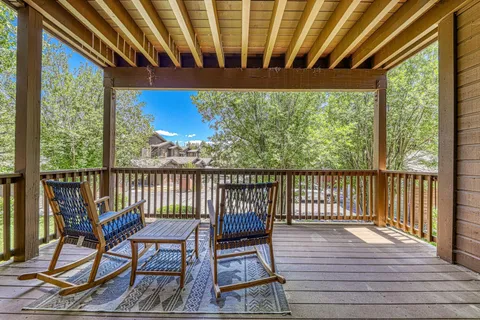 a view of a two chairs in the balcony