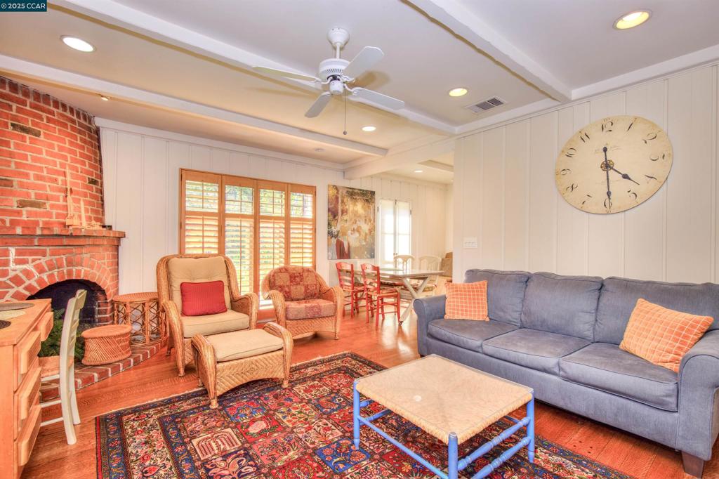 Undisclosed Address Walnut Creek, CA 94596 - Photo 4 of 12 a living room with furniture a clock and a large window