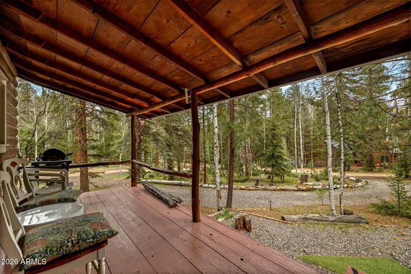 a view of a yard with wooden floor