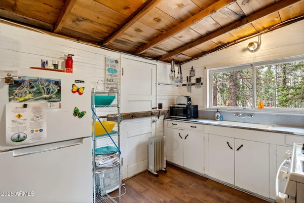 a kitchen with a stove and a table