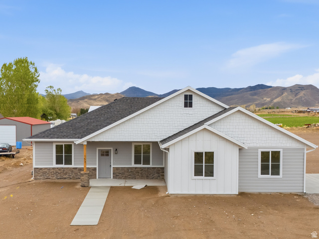 157 West 100 South Joseph, UT 84739 - Photo 1 of 30 Craftsman inspired home with covered porch, stone siding, a mountain view, and board and batten siding