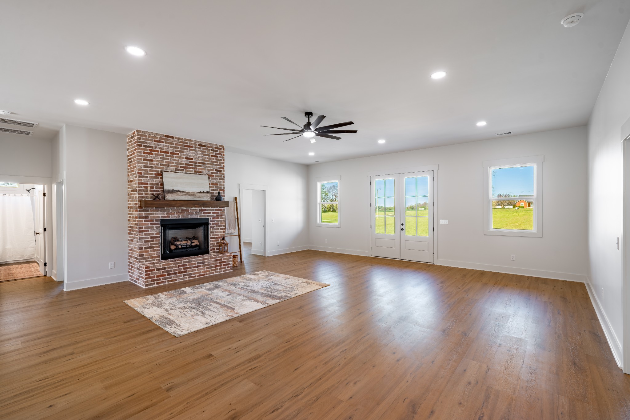 4031 Wells Road Springfield, TN 37172 - Photo 8 of 39 an empty room with windows and fireplace