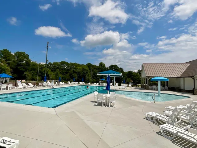 a view of tennis court with houses