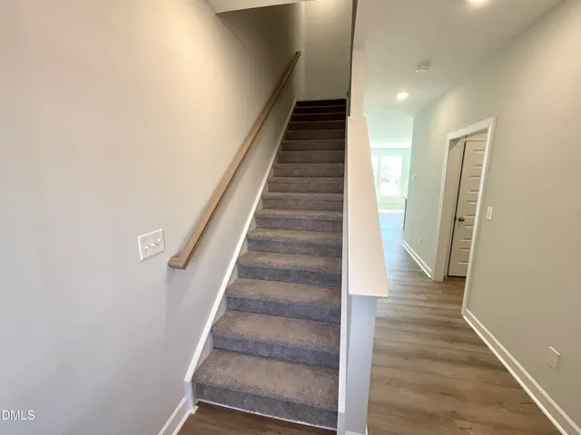 a bedroom with a balcony a bed and a couch