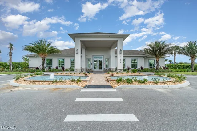 a living room with furniture kitchen view and a large window