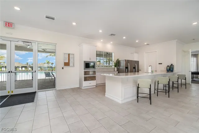 a living room with furniture a window and a table