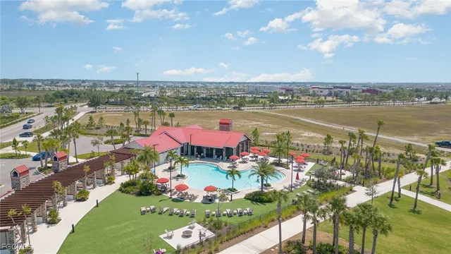an aerial view of a house with a garden and deck