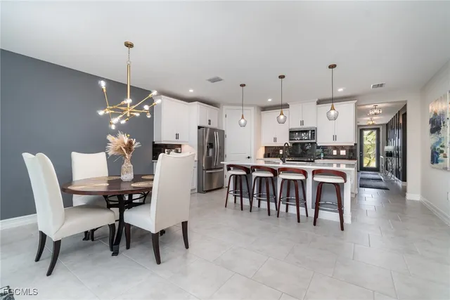 a dining room with furniture a window and kitchen view