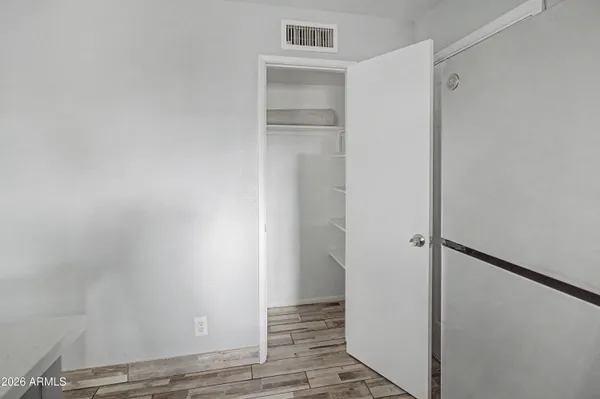 a kitchen with a cabinets and wooden floor