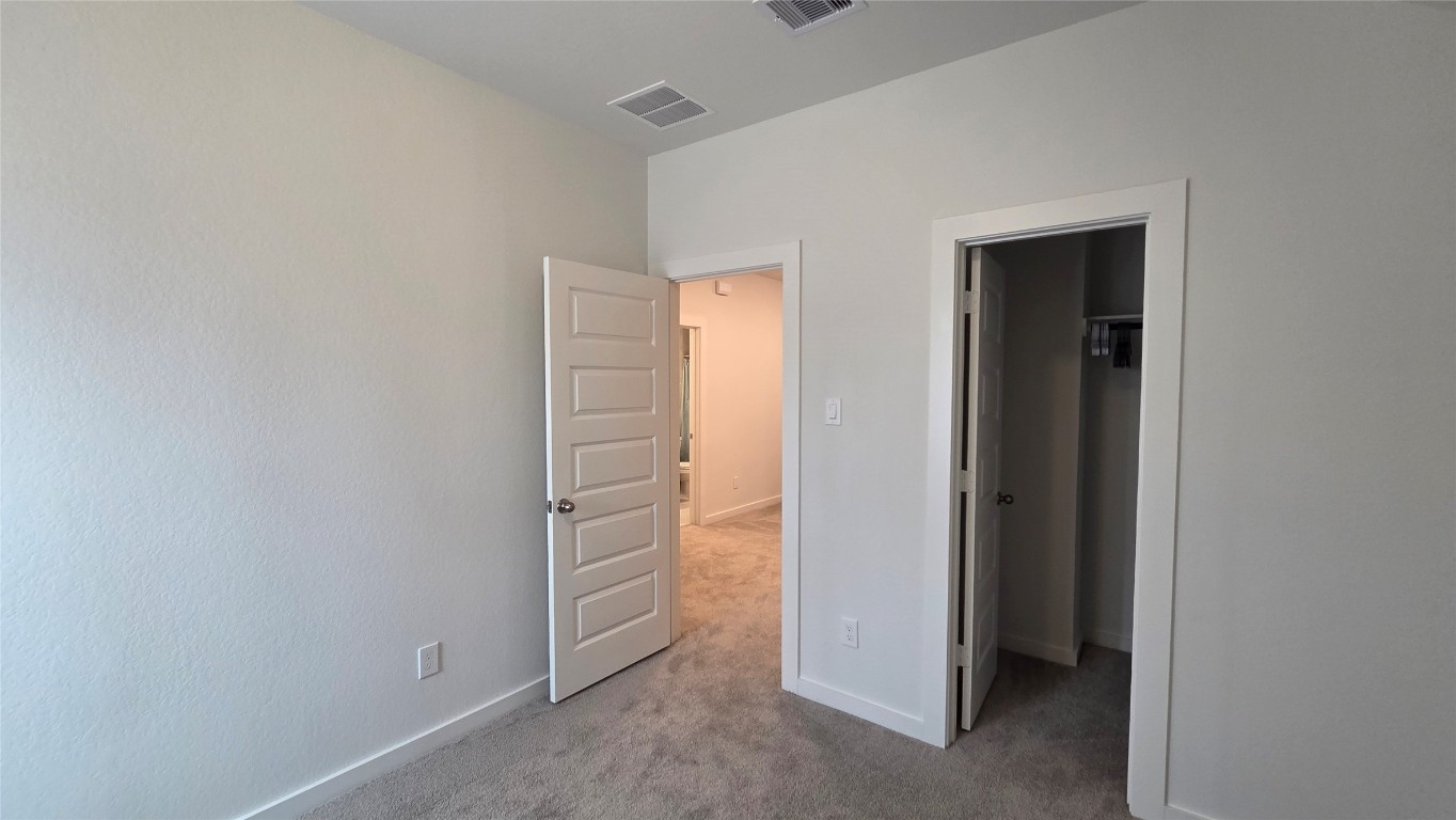 1015 Thor Roman Forest, TX 77357 - Photo 14 of 15 a view of walk in closet with clothes